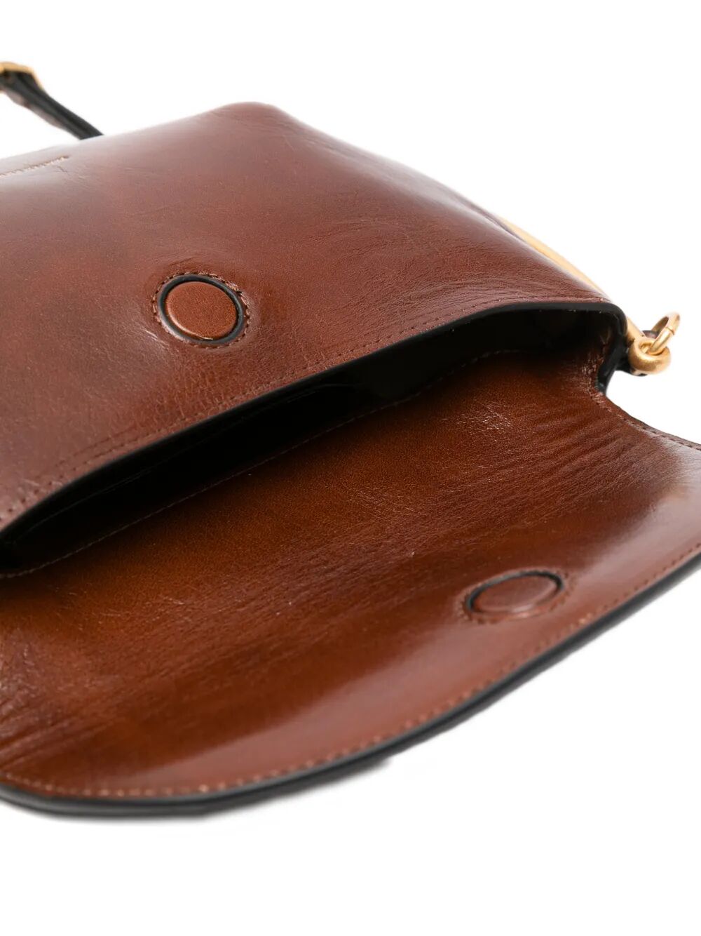 Borsa in pelle marrone con tracolla e motivo decorativo in oro